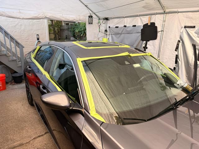 Trim and glass masked with tape